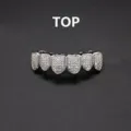 Detailed closeup of iced out hip hop grillz top teeth, micro pave zirconia grill. - Silver Upper Tooth