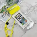 Transparent waterproof phone pouch with bright yellow seal and lanyard for underwater use. - Yellow