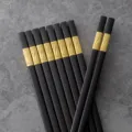 Black alloy chopsticks set with gold pattern, stylish and durable tableware for home kitchen use. - Clover / 27cm / Gold