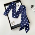 Detailed view of navy blue polka dot skinny twilly scarf, perfect for neckerchief or bag accessory. - 200cm / Navy Blue Polka Dot