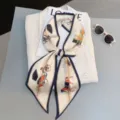 Elegant silk twilly scarf with vintage carriage print, versatile long ribbon for hair or bag. - Style 12