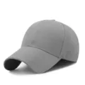 Solid grey acrylic baseball cap with curved brim, ideal for casual outdoor sun protection. - One Size / Light Gray