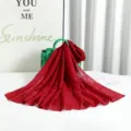 Detail view of the red pleated solid color long scarf with shiny silver wire texture for women. - Burgundy with Silver Thread