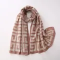 Detail view of the pink geometric patterned cotton-linen feel scarf, elegant and cozy. - Khaki Geometric Fret Pattern