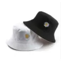 Classic cotton bucket hat with cute daisy embroidery, black and white reversible design. - M (56-58cm) / Reversible White & Black
