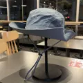 Grey outdoor sun protection bucket hat with mesh panels, adjustable chin strap, and logo print. - Mesh Quick-Dry - Dark Grey