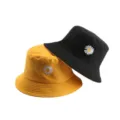 Unisex double-sided bucket hat with cute daisy embroidery for stylish daily sun protection. - M (56-58cm) / Reversible Yellow & Black