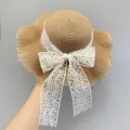 Detail view of women summer beach straw hat with elegant white lace bow big brim sun hat - M (56-58cm) / Leaf Floral Edge / Khaki