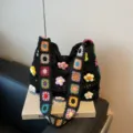 Handmade crochet shoulder bag with colorful floral patterns and 3D flower decors. - Black