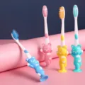 Close-up of colorful macaron cartoon bear handle soft bristle kids toothbrushes with suction base. - 4 Pieces/Pack / Colorful