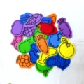 Close-up of colorful foam fruit and vegetable stickers set showing various shapes and bright colors. - Mixed Fruit & Vegetable