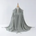 Details of the light green tassel hijab featuring elegant silver wire edges and wooden beads. - 8#