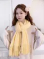 Soft light yellow knitted tassel scarf for women, cozy winter warm fashion accessory detail. - Bright yellow