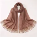 Detailed view of the elegant brown chiffon hijab featuring sparkling sequin and tassel fringe. - A07