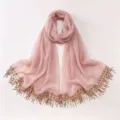 Elegant light pink chiffon hijab scarf featuring sparkling sequin and tassel trim details. - A08