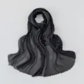 Detailed shot of black pleated island silk hijab, featuring delicate embroidery details. - 180*70cm / 6# Black