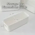 Minimalist white rectangular desktop storage box showing dimensions 26.7 x 9.5 x 9 cm - L