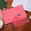 Solid color coral pink cashmere-feel winter scarf with elegant fringe and soft texture. - Watermelon red