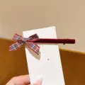 Sweet plaid ribbon bow hair clip detail view, featuring red velvet texture and cute ribbon design. - Red Velvet Red Plaid