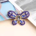 Charmant pendentif papillon en strass pour nail art avec cristaux bleus et gris scintillants. - Bleu