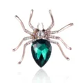 Elegante kristallen spinnenbroche met donkergroene edelsteen en gouden insectensieraad. - Goud + Groen