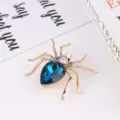 Modieuze stras spin broche luxe blauwe kristal insect speld voor dames kleding - Goud + Pauwenblauw