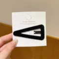 Detailed close-up of Korean style black velvet triangle hair clip, elegant texture. - Triangle / 1 Piece / Black