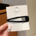 Minimalist black drop-oil oval hair clip for women, elegant side hairpin and hair accessory. - Tapered Hair Claw / Black
