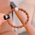 Brown textured hair tie with white pearl, high elasticity elastic band for daily styling. - Pearl Camel