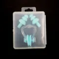 Silicone swim earplugs and nose clip detail view, soft waterproof gear in clear box. - Lake Blue
