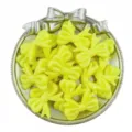 Yellow acrylic bow beads detail shot, ideal for DIY handmade charm bracelets and jewelry making. - Yellow