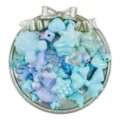 Detailed view of mixed blue acrylic beads, star and bow shapes for DIY jewelry crafts. - Blue