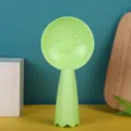 Standing rice paddle with smiley face non-stick plastic spoon for kitchen rice cooker use. - Green