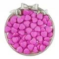Detailed view of pink acrylic heart beads with vertical holes, perfect for DIY jewelry and crafts. - Rose Red