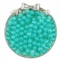 Detail shot of turquoise acrylic luminous jelly round beads in silver bow container for DIY craft. - Aqua Green