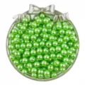 Close up detail of shiny green imitation pearl round beads with center hole for DIY jewelry crafts. - Grass Green