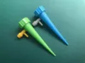 Automatic plant waterer detail, adjustable drip irrigation spike for indoor potted green plants. - 1 Set / Green