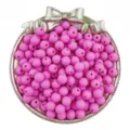 Close-up detail of bright pink matte round beads displayed in a decorative silver bow tray. - Rose Red