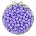Close up of purple acrylic round loose beads in silver bow tray for DIY jewelry making detail - Purple