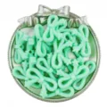 Close-up of mint green acrylic star bow beads, ideal for DIY handmade bracelet jewelry making. - Green