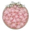 Detailed view of 15mm pink acrylic star beads in a decorative bow tray for DIY jewelry making. - 20 Pieces/Pack / Pink