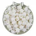 Close-up detail of white acrylic star beads in decorative silver tray, DIY jewelry making. - 30 Pieces/Pack (14mm) / Beige