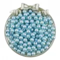 Detailed shot of light blue ABS pearl beads in a bow tray, perfect for DIY craft jewelry. - Light Blue
