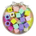 Detail view of colorful acrylic cube letter beads in silver tray for DIY jewelry making. - 20 Pieces/Pack / Random Mixed Colors