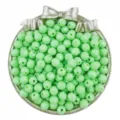 Close-up of 8mm faceted green acrylic beads displayed in a decorative silver bowl. - 50 Pieces/Pack / Green