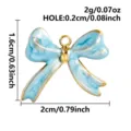 Blue enamel bow pendant detail showing size specifications and stainless steel charm design. - Blue Gold
