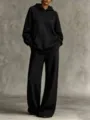Detailed view of women's oversized black hoodie and wide-leg sweatpants set in soft cotton - S / Top And Bottom / Black