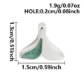 Stainless steel fish tail pendant with green enamel detail, perfect for DIY jewelry making. - Steel Color With Green Glitter (S3232-S-G)