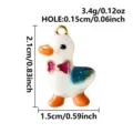 Leuke geëmailleerde eend hanger roestvrij staal DIY sieraden bedel met strik en glinsterende vleugels - Gouden Eend (B258-G) / 2.1x1.5cm