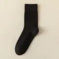 Men's solid black mid-calf warm socks, cozy winter knit fabric for comfortable daily wear. - One Size / Black